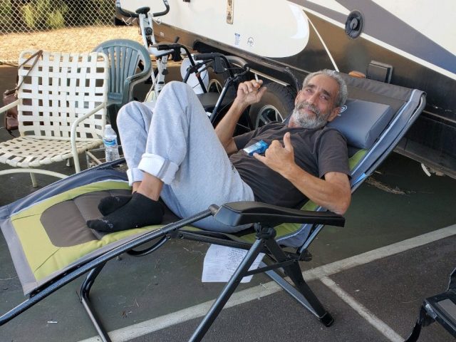 Coleman lies on the chair on which he would later pass.