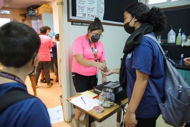 A photo of a student at Lokelani Intermediate School selling shave ice