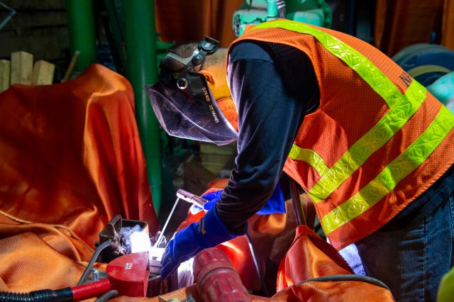 AIEA, Hawaii (Jan. 13, 2022) – Josiah Kaleo, a Naval Facilities Engineering Systems Command contractor, welds a pipe used in the granular activated carbon filtering process at the Red Hill Well Shaft. The Interagency Drinking Water System Team is a joint initiative where the U.S. Navy is working closely with the Hawaii Department of Health, U.S. Environmental Protection Agency and the U.S. Army to restore safe drinking water to Joint Base Pearl Harbor-Hickam housing communities, and recover the Red Hill Well to protect the aquifer. For detailed information, go to: www.navy.mil/jointbasewater. (U.S. Navy photo by Mass Communication Specialist 1st Class Luke McCall)