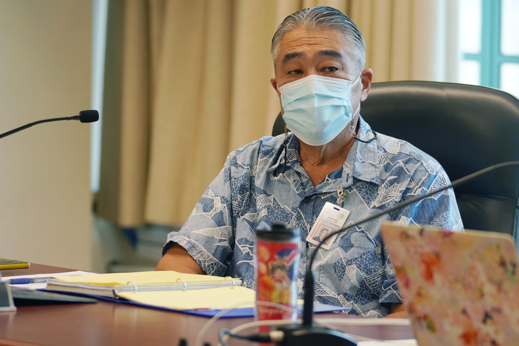 DOE Department of Education board member William Arakaki attends board meeting.