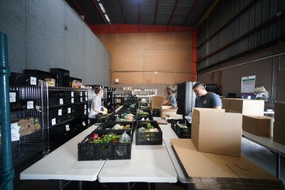Farm Link Hawaii workers preparie orders to be delivered at their warehouse located in Kalihi.