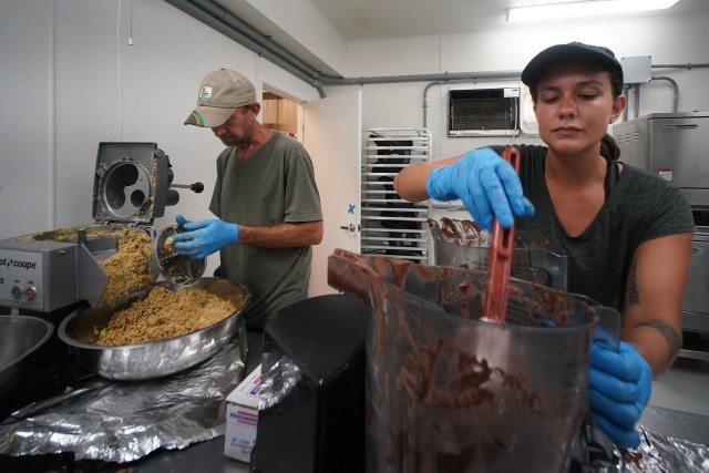 Hawaii Ulu Cooperative Operations Production Supervisor Leilani Aveiro blends ulu with chocolate in the professional kitchen located at the warehouse.