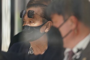 Dennis Mitsunaga walks out from US District Court.