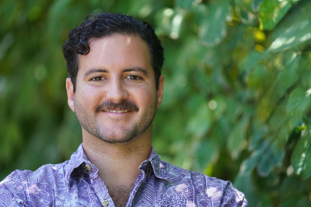 Evan Weber stands outside his Kailua residence.