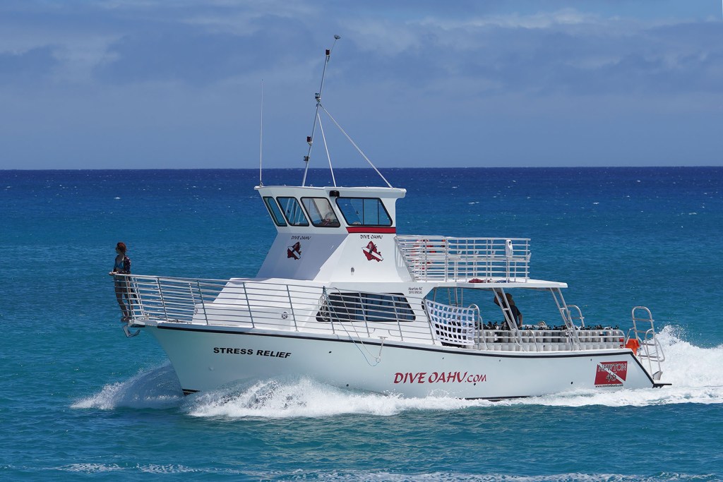 Dive Boat tourism Stress Relief heads into Kewalo Harbor.