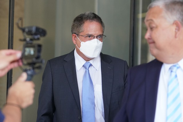 Former Senator J. Kalani English leaves US District Court after being sentenced.