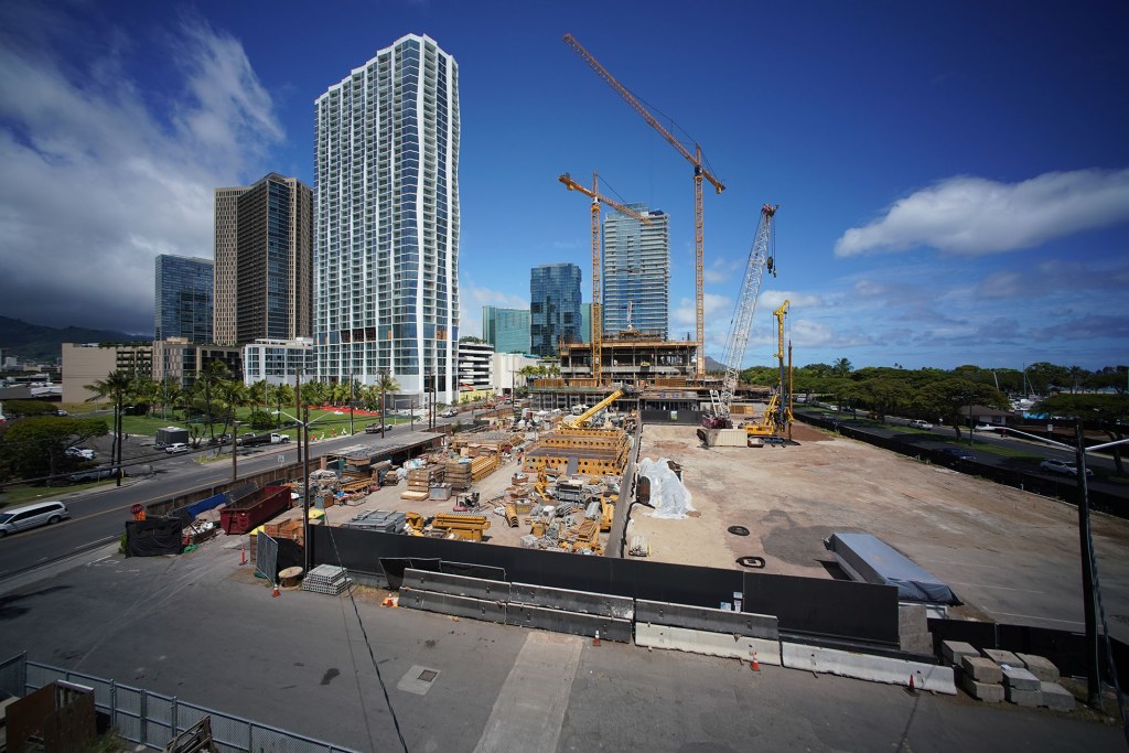 Construction cranes located in the Ward/Kakaako areas building more condominium towers.