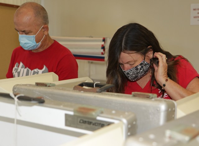 Karen Carvalho and her husband Edward Dickson voted in person on Saturday at Hilo's Aupuni Center. Photo: Tim Wright