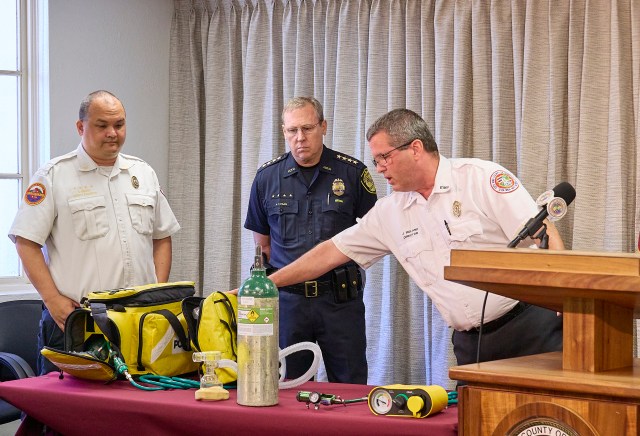 Ambulance Fire Review, Ambulance Oxygen equipment, Honolulu EMS Director Dr. Jim Ireland, Honolulu Police Chief Arthur "Joe" Logan and Ocean Safety Lifeguard Deputy Director Ian Santee, explain the Oxygen equipment found in Honolulu EMS ambulances