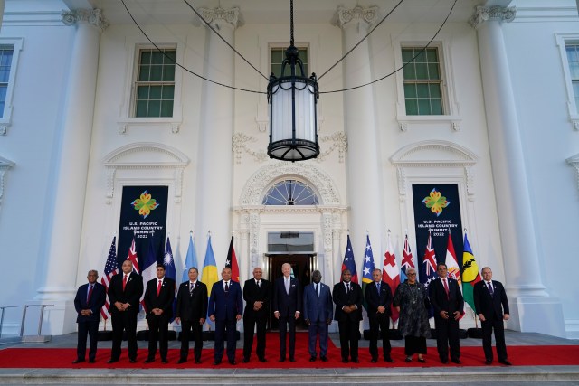 President Joe Biden, center, poses for a photo with Pacific Island leaders on the North Portico of the White House in Washington, Thursday, Sept. 29, 2022. From left, New Caledonia President Louis Mapou, Tonga Prime Minister Siaosi Sovaleni, Palau President Surangel Whipps Jr., Tuvalu Prime Minister Kausea Natano, Micronesia President David Panuelo, Fiji Prime Minister Josaia Voreqe Bainimarama, Biden, Solomon Islands Prime Minister Manasseh Sogavare, Papua New Guinea Prime Minister James Marape, Marshall Islands President David Kabua, Samoa Prime Minister Fiame Naomi Mata'afa, French Polynesia President Edouard Fritch and Cook Islands Prime Minister Mark Brown. (AP Photo/Susan Walsh)