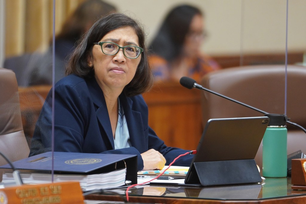 Honolulu City Council member Esther Kiaaina listens to testimony during floor session at Honolulu Hale.