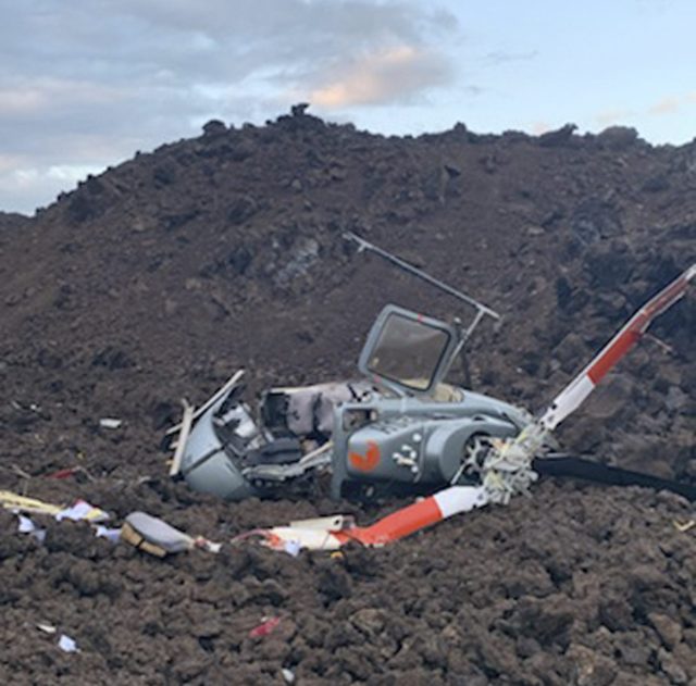 FILE - In this photo provided by the Hawaii County Fire Department is the scene where a helicopter crashed in a Big Island lava field in Hawaii, Wednesday, June 8, 2022. The National Transportation Safety Board is releasing various documents Monday, Oct. 31, 2022, related to the Hawaii helicopter crash that injured all six people on board the sightseeing tour. (Hawaii County Fire Department via AP, File)