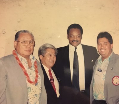 Former IBEW business manager Brian Ahakuelo, right, pictured with his father Norman Ahakuelo, Richard Oyama and Jesse Jackson.