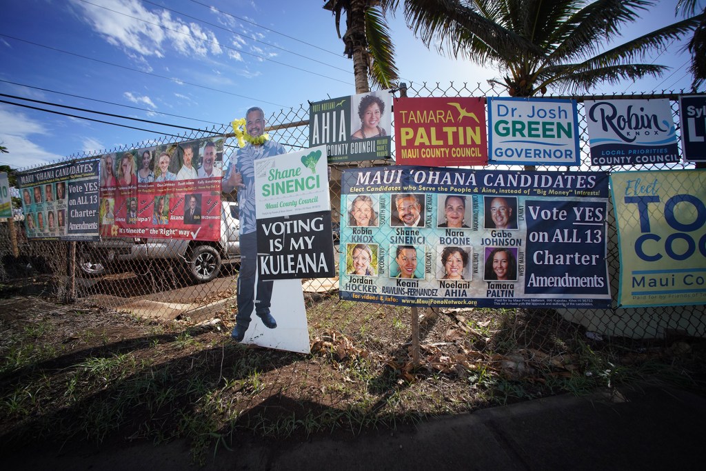 Election signs along a fence along Waiale Road in Wailuku, Maui.