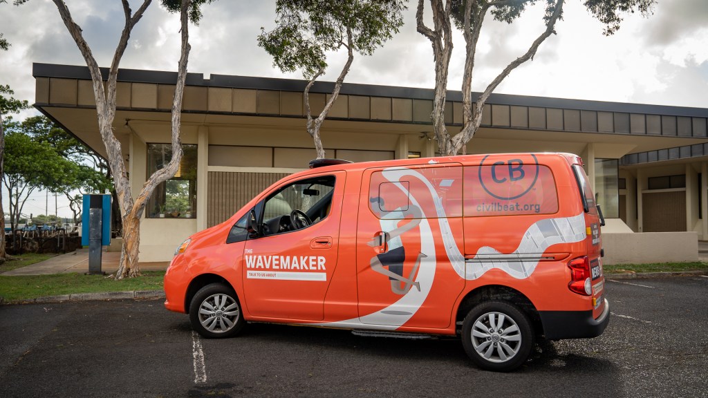 The Civil Beat "Wavemaker" Van parked outside of a state library.