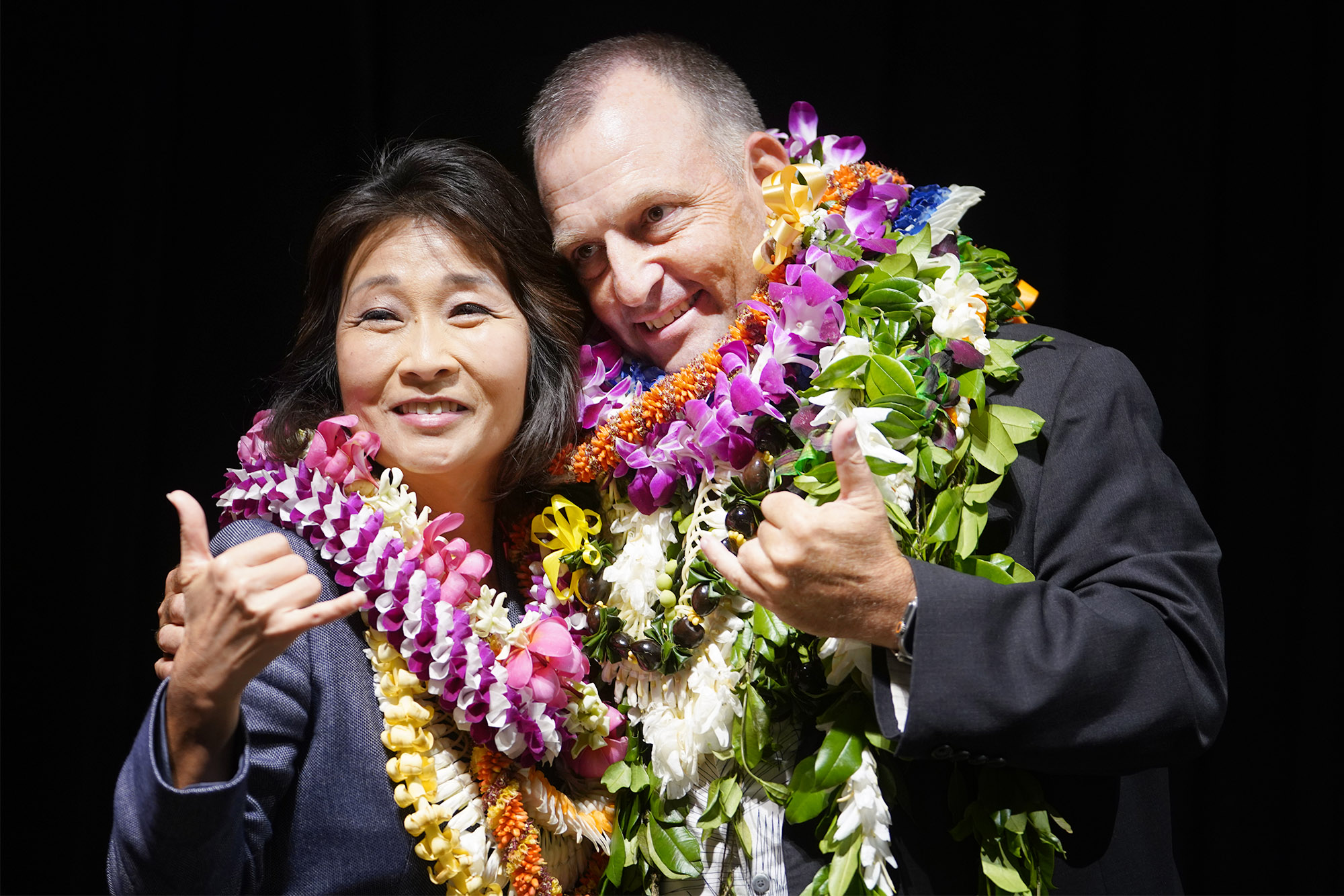 Lt. Gov. Sylvia Luke and Gov. Josh Green flash the shaka at the Hawaii Convention Center.
