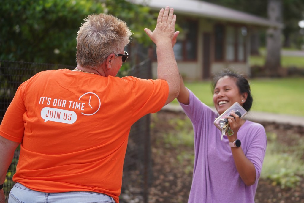 Right, Uri Cabatu gets a high-5 as she found out she's moving into housing in the new Pulama Lanai's Hokuao housing on Lanai.