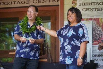 Pulama Lanai Director of Commercial and Rental Properties Noemi Barbadillo assists Council member Gabe Johnson in a raffle of folks that applied for affordable housing in the Pulama Lanai's Hokuao's housing on Lanai.