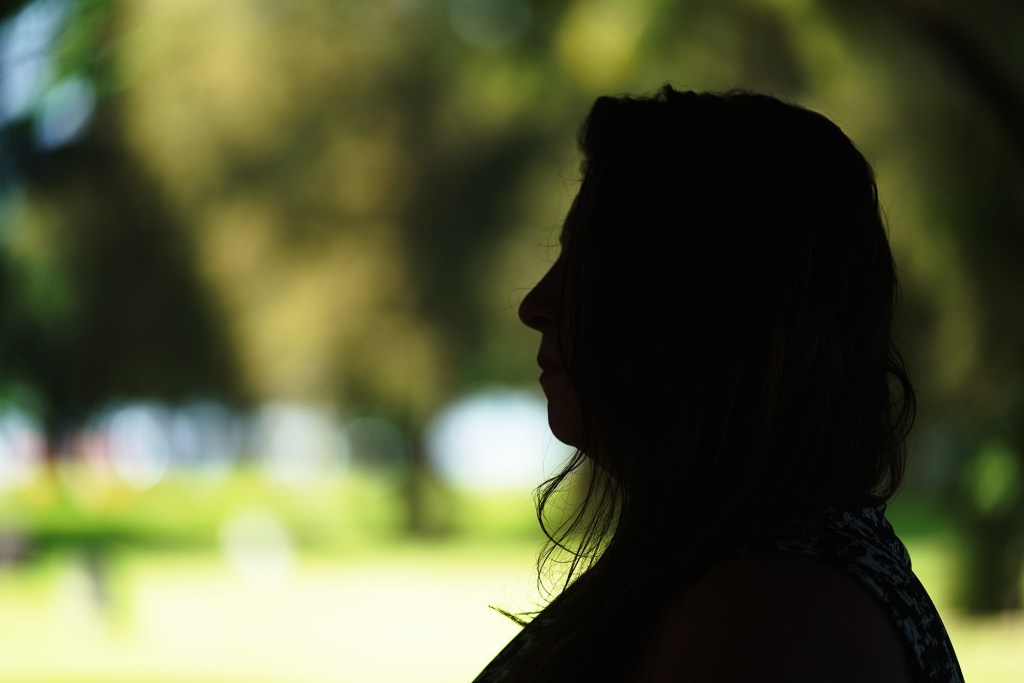 Sarah Coultas silhouetted portrait. Sarah does not want her face visible and agreed to a silhouette image.