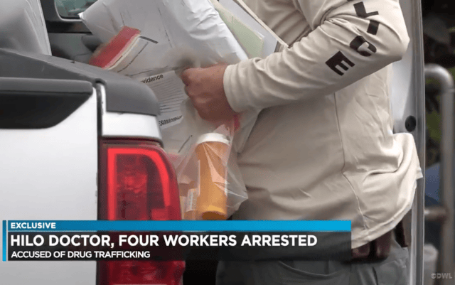 Police remove evidence from a Hilo medical practice illegally disseminating prescription drugs