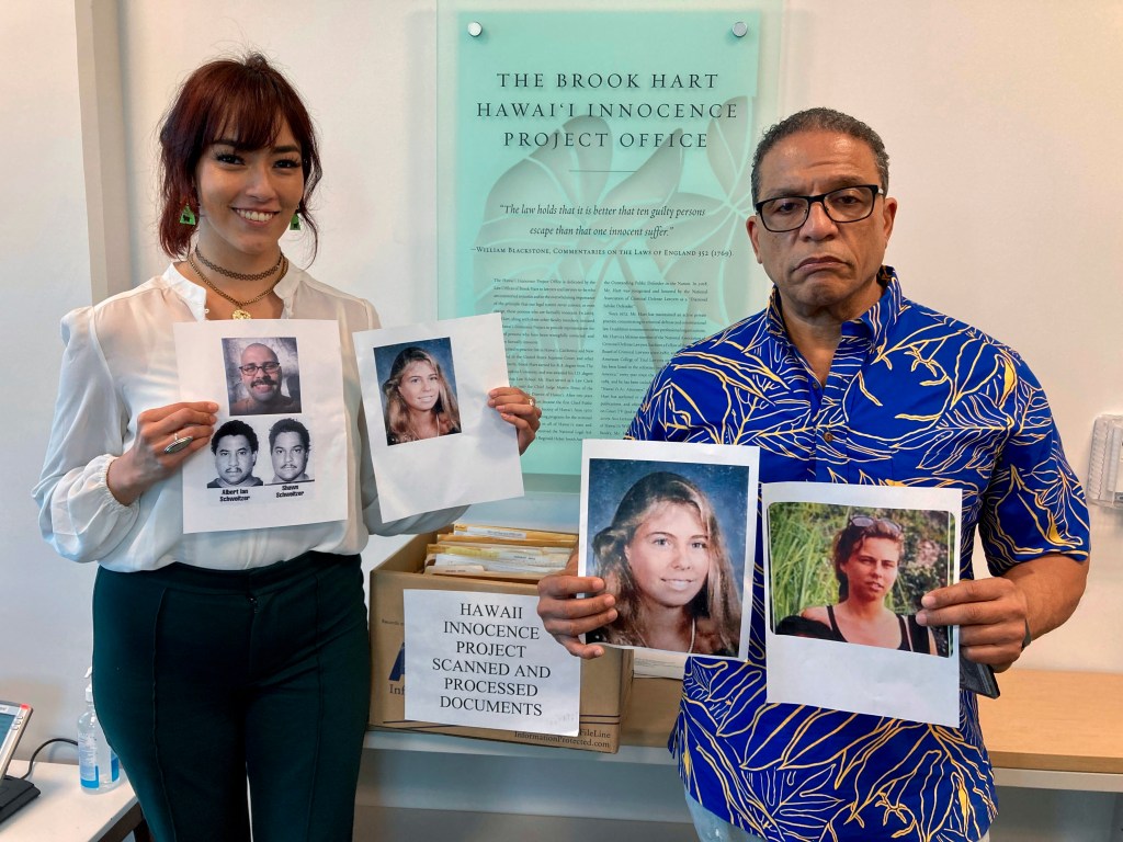 University of Hawaii law school student Skye Jansen, left, and Hawaii Innocence Project co-director Kenneth Lawson pose with photos related to the 1991 murder of Dana Ireland in Honolulu on Tuesday, Jan. 17, 2023. A petition filed Monday, Jan. 23 outlining new evidence in one of Hawaii's biggest criminal cases asks a judge to release Albert “Ian” Schweitzer, a Native Hawaiian man who has spent more than 20 years in prison for the sexual assault, kidnapping and murder of Ireland, a white woman, on the Big Island. (AP Photo/Jennifer Sinco Kelleher)