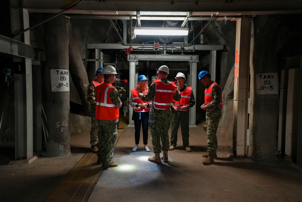 Red Hill Bulk Fuel Storage Facility (RHBFSF) tour participants talk during a site visit in Halawa, Hawaii, Jan. 25, 2023. Secretary of the Army Christine Wormuth toured the RHBFSF to gather more insight into the Joint Task Force-Red Hill (JTF-RH) mission and to discuss the contributions of Army personnel to the effort. The Department of Defense established JTF-RH to ensure the safe and expeditious defueling of the RHBFSF. (U.S. Army photo by Spc. Matthew Mackintosh)