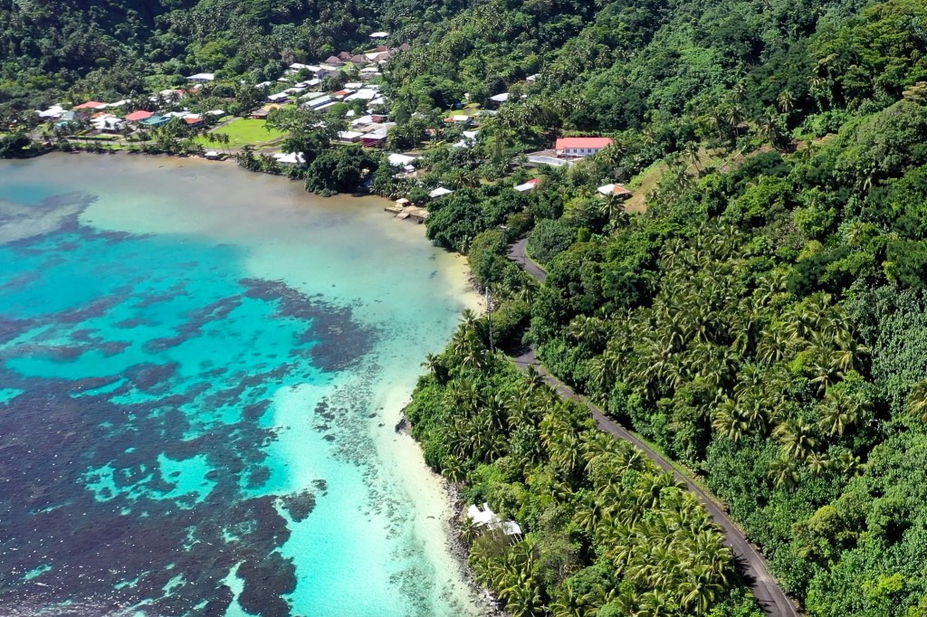 A coastal road and village in American Samoa in 2019.