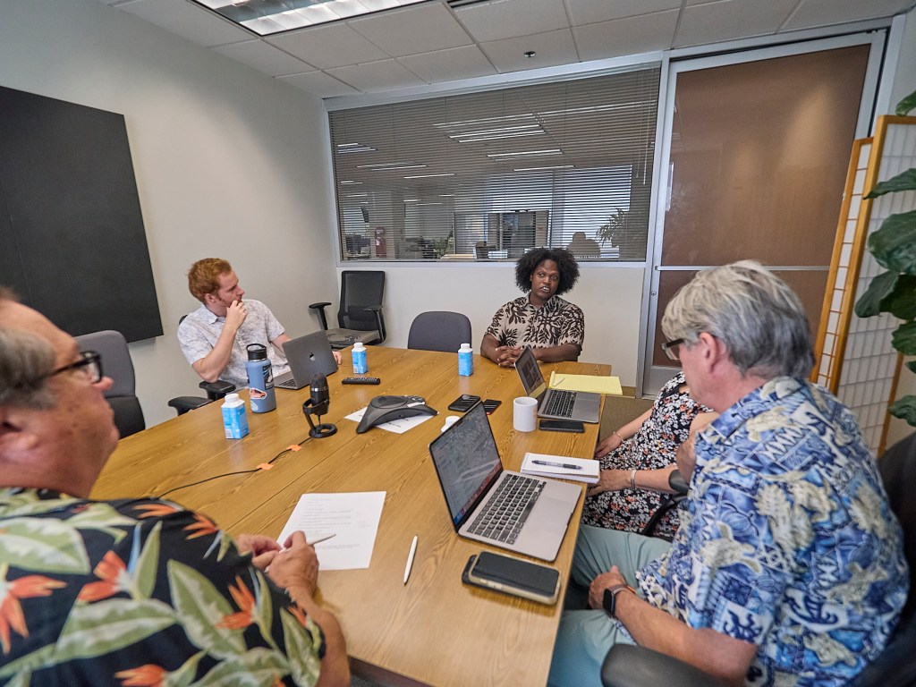 Camron Hurt, Common Cause Hawaii's new Program Director dominates the image as he discusses elements of a free society with Civil Beat's Editorial Board