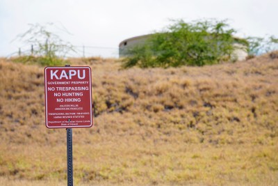 State Hawaii Department of Hawaiian Home Lands sign warning kapu water tank round structure Kailapa Community Association Waimea DHHL Department of Hawaiian Home Lands water storage