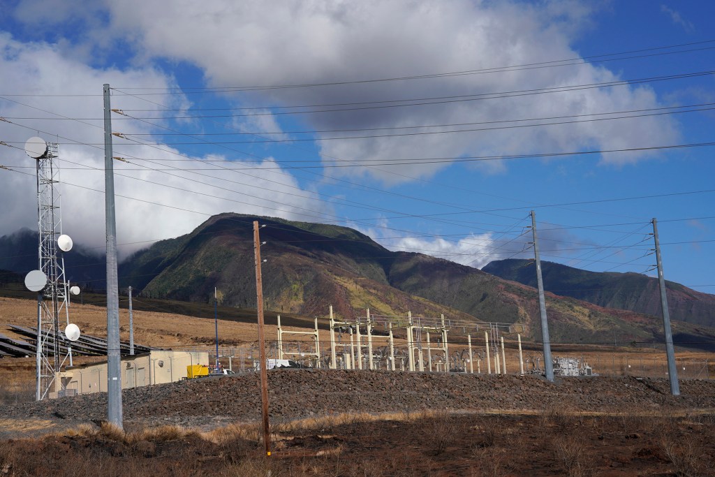 The HECO power station mauka of the Lahaina Bypass sits directly above the charred remains of a large wildfire Sunday, Aug. 13, 2023, in Lahaina. A large fire consumed areas of West Maui last week. Utilities have not been fully restored. (Kevin Fujii/Civil Beat/2023)