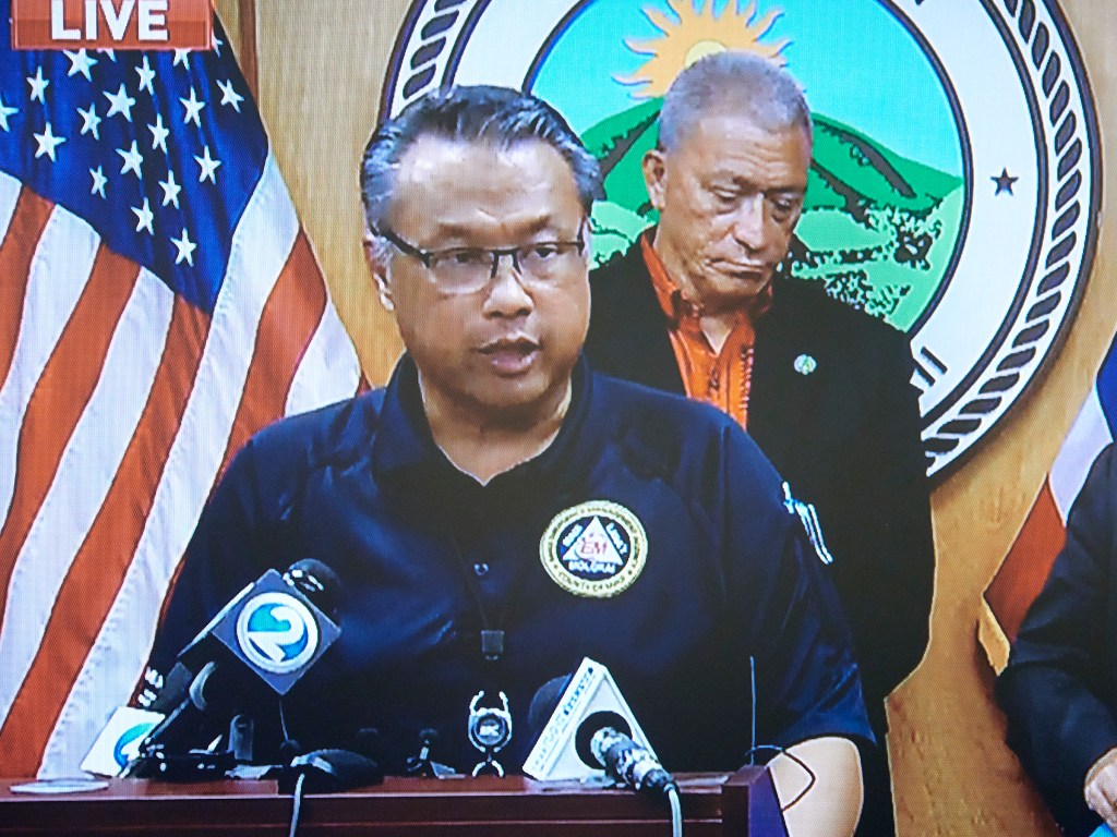 Herman Andaya stands at the podium in the Mayors conference room in Wailuku