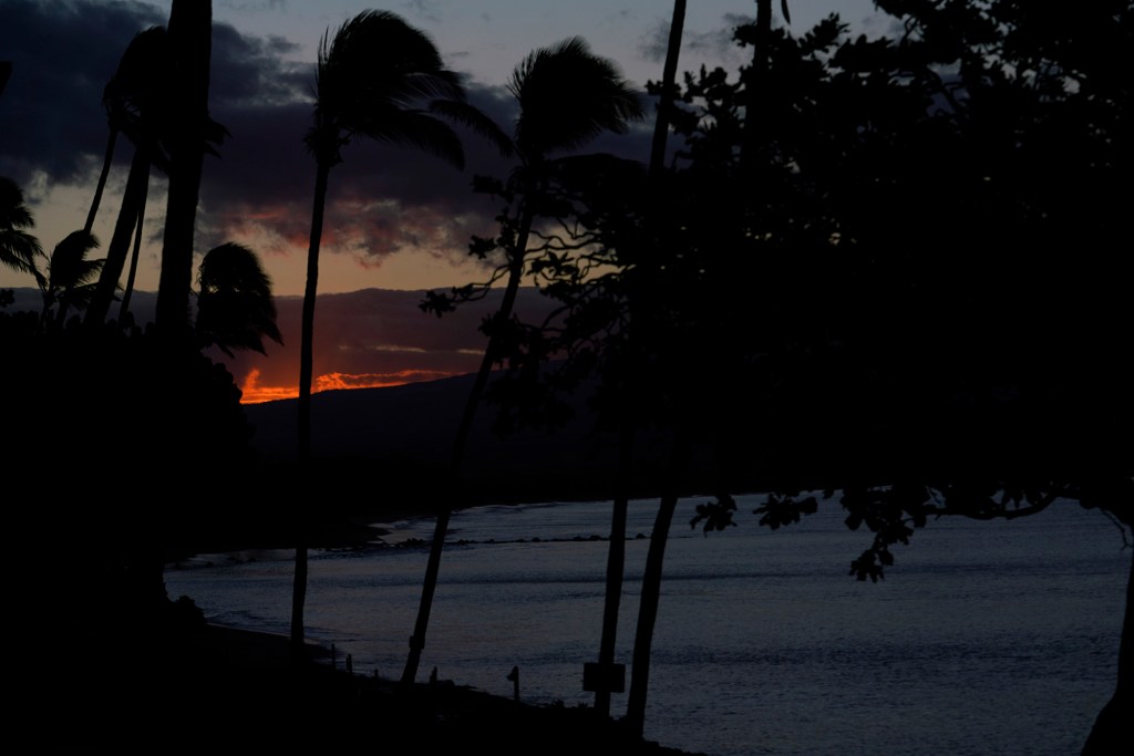 The sunrise cast an eerie glow Tuesday, Aug. 22, 2023, in Maalaea. The recent destructive wildfire made this scene uncomfortable. (Kevin Fujii/Civil Beat/2023)