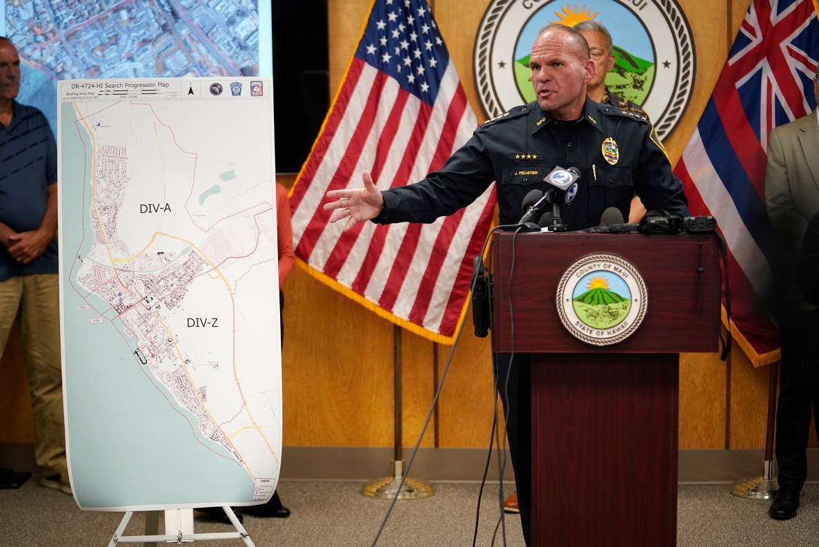 Maui Police Chief John Pelletier points to a map of searched locations during a press conference Tuesday, Aug. 22, 2023, in Wailuku. The gathering was to share information on those missing and the process to identify remains found in the Aug. 8 Lahaina wildfire. (Kevin Fujii/Civil Beat/2023)