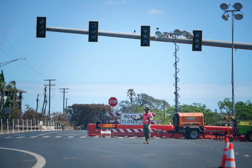 Hawaii National Guard continue to block entrances to Lahaina town Saturday, Aug. 26, 2023. The historical town was destroyed by wildfire on Aug. 8. (Kevin Fujii/Civil Beat/2023)