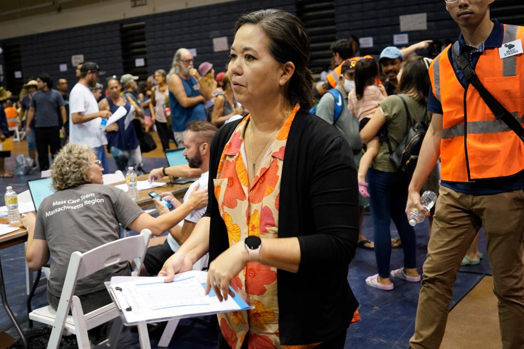 Rep. Jill Tokuda makes rounds at the federal resources fair Saturday, Aug. 26, 2023, in Lahaina. Rep. Tokuda and Senator Mazie Hirono hosted the event. It was designed to help fire victims obtain federal assistance for important paperwork lost in the Aug. 8 fire. (Kevin Fujii/Civil Beat/2023)