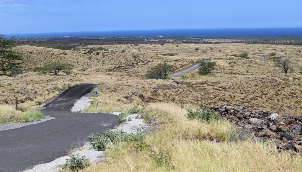 The Waikoloa Emergency Road is paved with gravel in areas and is locked up. It is currently the only other way out of the South Kohala township, which has been a subject of concern for years.