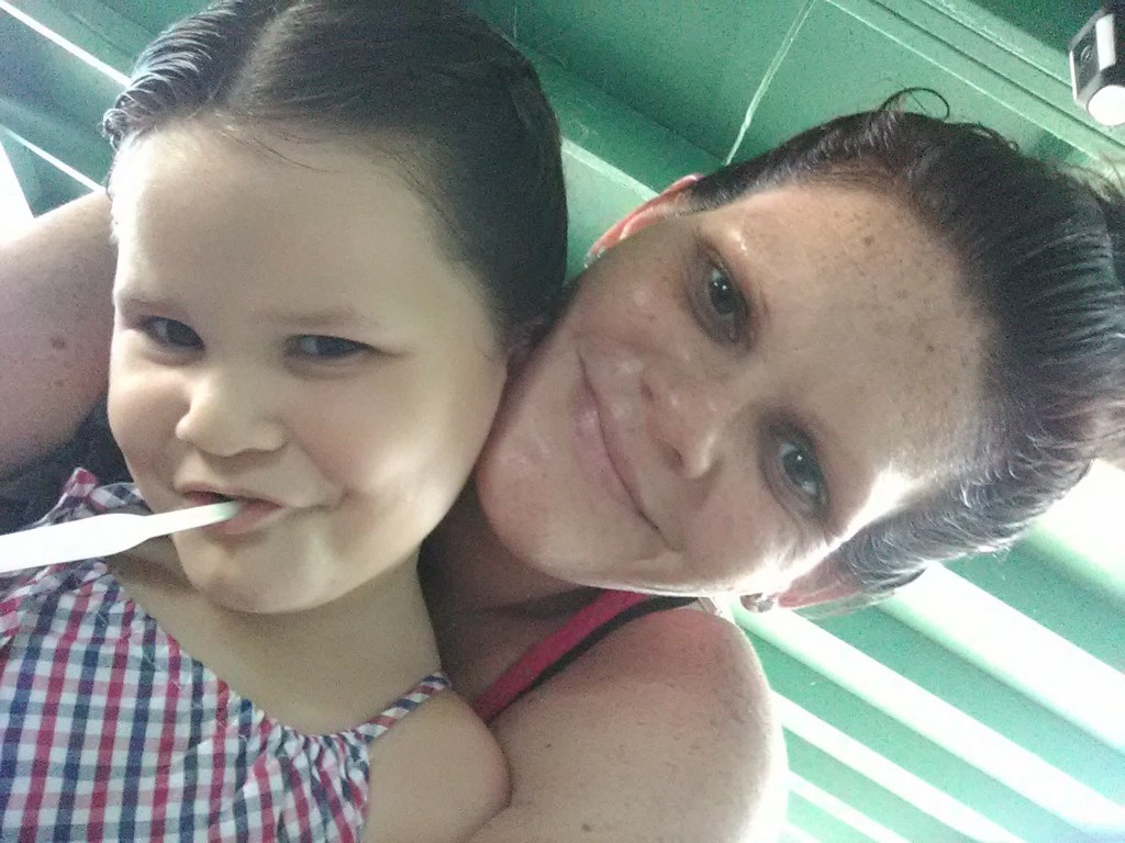 Melanie Joseph hugs her smiling daughter Ariel Sellers, later renamed Isabella Kalua by her adoptive parents.