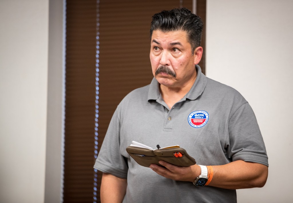 U.S. Environmental Protection Agency incident commander Steve Calanog reviews his notes during a press conference, Aug. 29, 2023. (Nathan Eagle/Civil Beat/2023)