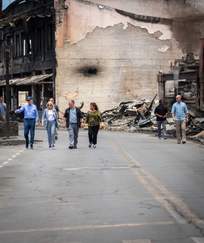 President Biden, First Lady Jill Biden, Gov. Josh Green and his wife, Jaime Green walk down Front Street in Lahaina, Monday. (Nathan Eagle/Civil Beat/2023)