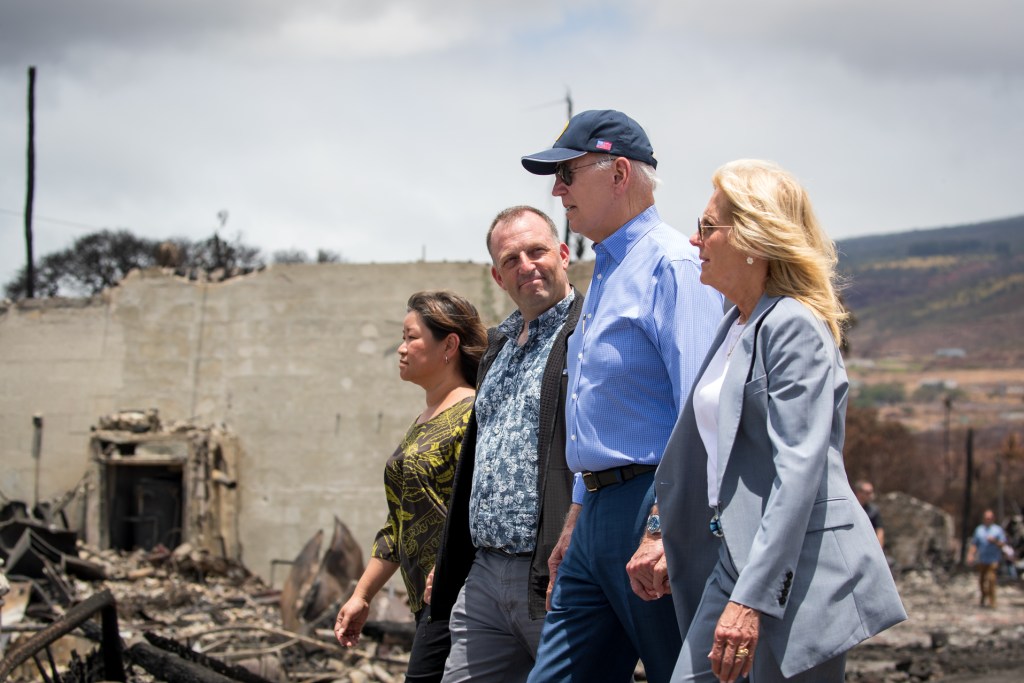 President Biden, First Lady Jill Biden, Gov. Josh Green and his wife, Jaime Green, walk down Front Street in Lahaina, Monday. (Nathan Eagle/Civil Beat/2023)