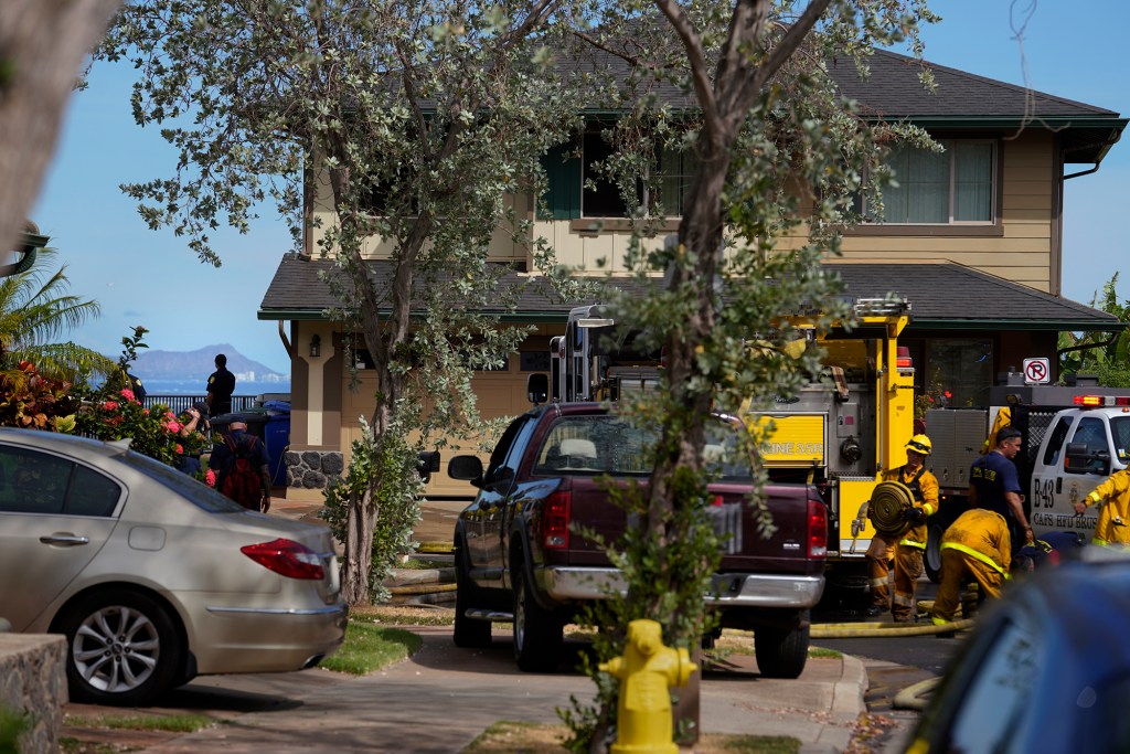 A view of Diamond Head is seen behind a Makakilo home after the Honolulu Fire Department extinguished a vegetation fire Tuesday, Sept. 5, 2023. The hillside neighborhood boarders undeveloped land. (Kevin Fujii/Civil Beat/2023)