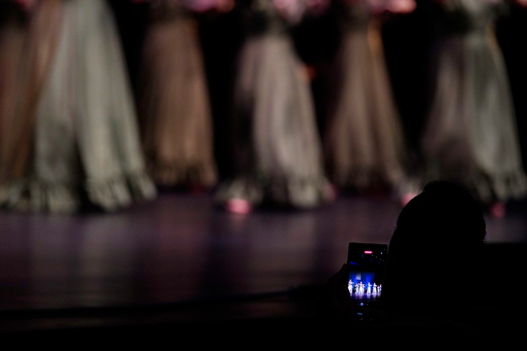 A spectator shoots video during the Ku Mai Ka Hula competition at the Maui Arts and Culture Center, Sept. 9, 2023, in Kahului. Life slowly returns to normal on Maui after the devastating August 8 wildfires. (Kevin Fujii/Civil Beat/2023)