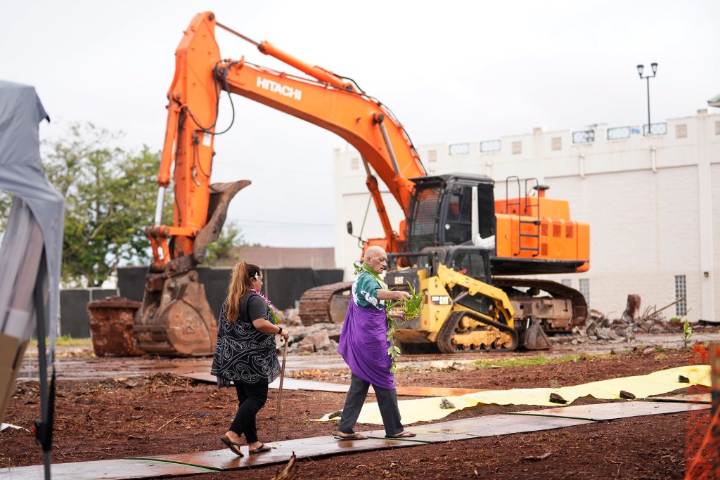 Hawaiian Civic Club of Wahiawa Kahu Peter Lonoaea performs the ceremonial blessing with president Noelani DeVincent before breaking ground for the Wahiawa Civic Center Tuesday, Sept. 26, 2023, in Wahiawa. The almost three-acre site will include two buildings for a courthouse, state offices and City and County of Honolulu satellite city hall. (Kevin Fujii/Civil Beat/2023)