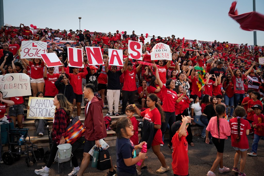Lahainaluna High School fans cheer during their first football game Saturday, Sept. 30, 2023, at War Memorial Stadium in Wailuku. The sold-out game paves the little way slowly back to normalcy after the devastating Aug. 8 fire. (Kevin Fujii/Civil Beat/2023)