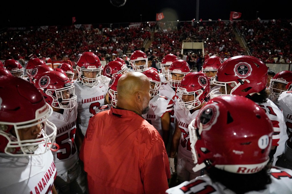 Lahainaluna High School co-head coach Dean Rickard fires up his team for their first football game Saturday, Sept. 30, 2023, at War Memorial Stadium in Wailuku. The sold-out game paves the little way slowly back to normalcy after the devastating Aug. 8 fire. (Kevin Fujii/Civil Beat/2023)