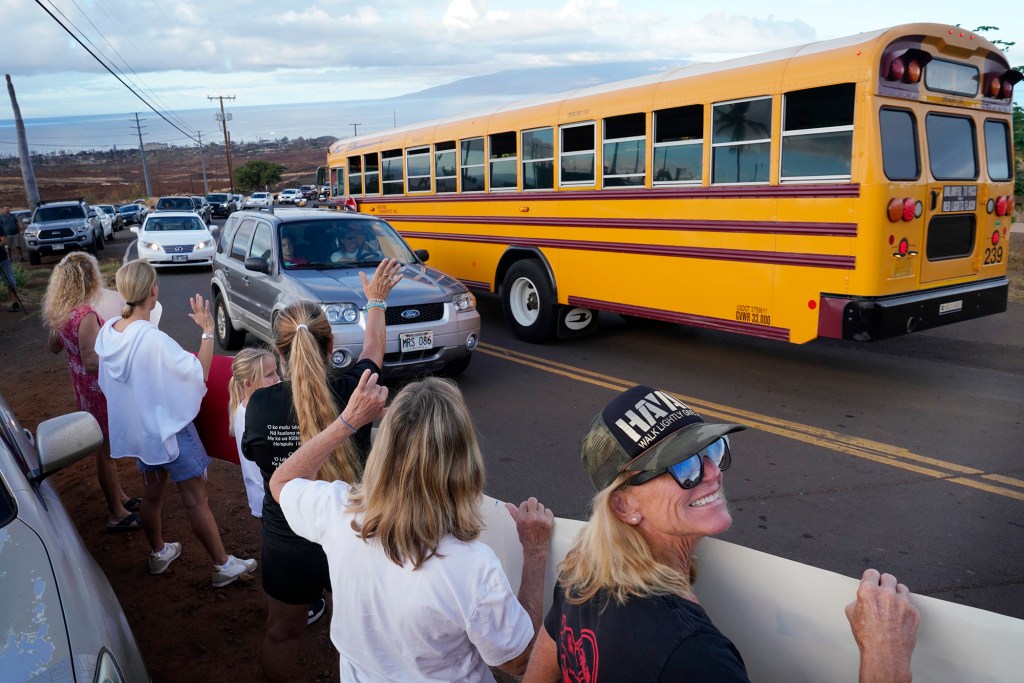 Lahainaluna supporters welcome students back to their campus Monday, Oct. 16, 2023, in Lahaina. The school has been closed since the Aug. 8 fire and studying at other schools in Maui. (Kevin Fujii/Civil Beat/2023)