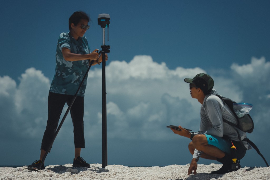 Haunani Kane conducting island surveys with Kainalu Steward at Lalo atoll. (Courtesy: Jason Patterson)