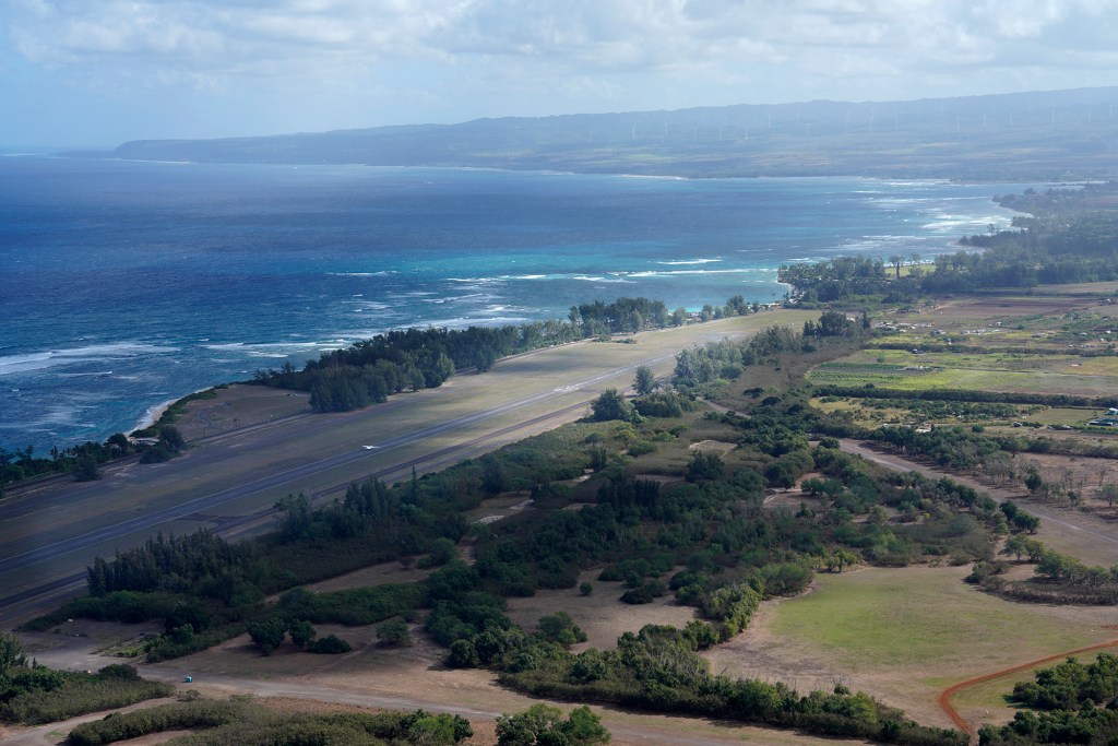 With the North Shore for a background, a Skydive Hawaii plane takes off from Dillingham Air Field Friday, Nov. 17, 2023, in Waialua. (Kevin Fujii/Civil Beat/2023)