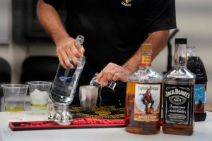A Honolulu Police officer mixes a drink during thee media workshop on Operating a Vehicle Under the Influence of an Intoxicant also known as OVUII or DUI on Saturday, Nov. 18, 2023, at the HPD training facility in Waipahu. HPD’s message comes as the winter holidays approach. (Kevin Fujii/Civil Beat/2023)