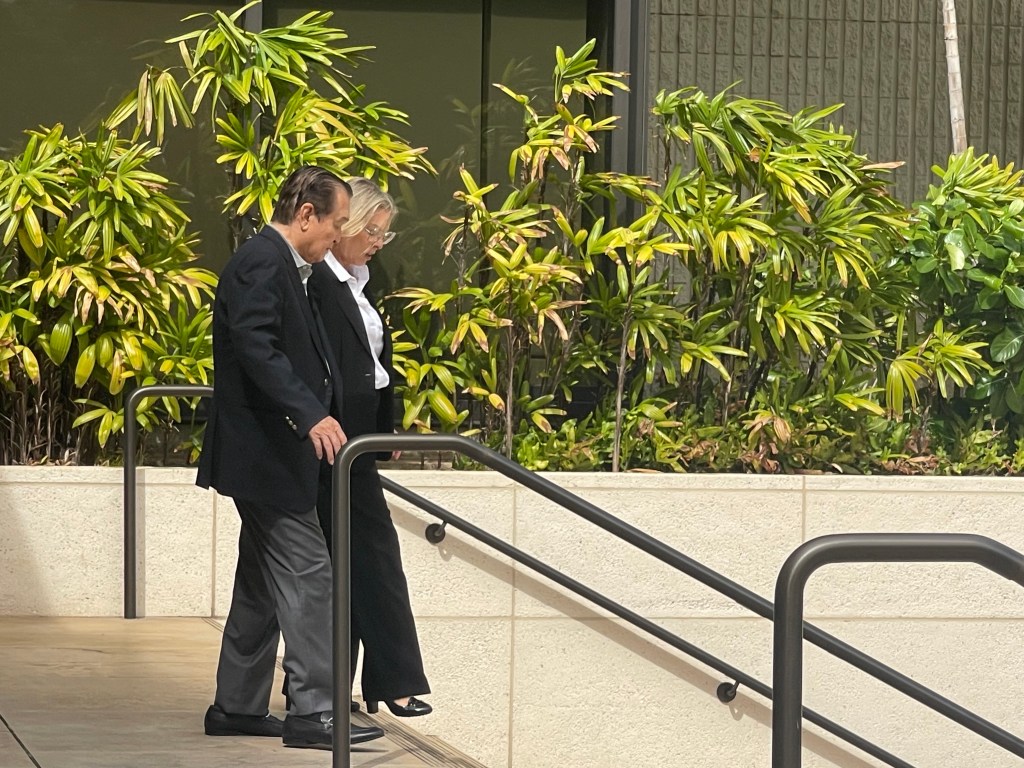 Dennis Mitsunaga appeared in federal court on Nov. 7, 2023 with his attorney Nina Marino. (Christina Jedra/CivilBeat/2023)